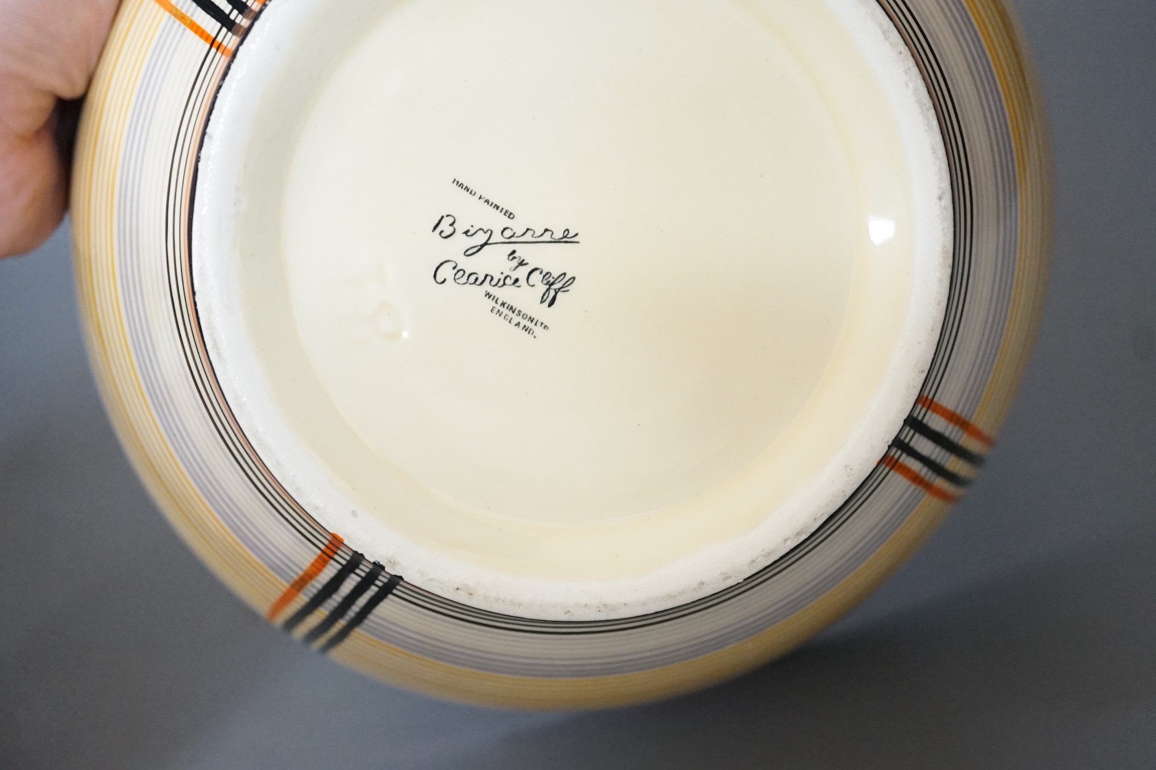 A Clarice Cliff bowl, 22cm and Doulton figure 'Invitation'